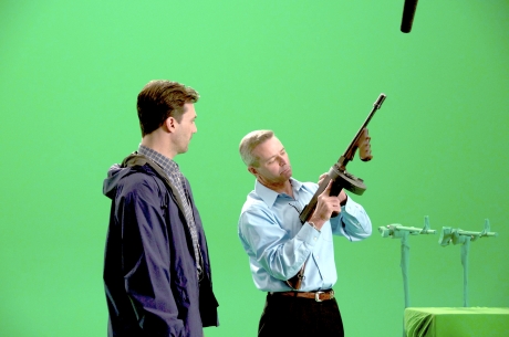 Decker reviews the open-safe configuration of a Thompson submachine gun with Golden Globe actor Jon Hamm